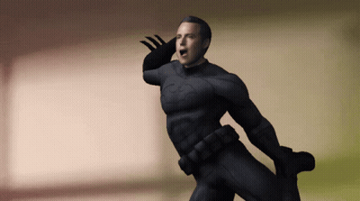 A Man In A Black Superhero Costume Is Waving GIF