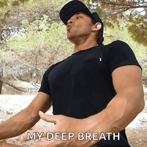 A Man In A Black T-Shirt Says " My Deep Breath " GIF