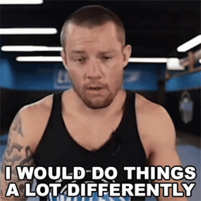 A Man In A Black Tank Top Is Saying " I Would Do Things A Lot Differently " GIF