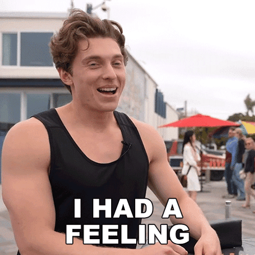 A Man In A Black Tank Top Is Smiling And Saying I Had A Feeling GIF