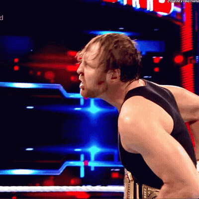 A Man In A Black Tank Top Is Standing In Front Of A Sign That Says The Next Thing On It GIF