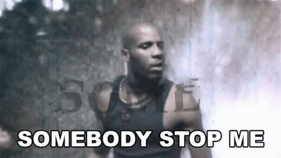 A Man In A Black Tank Top Is Standing In Front Of A Waterfall And Says `` Somebody Stop Me '' . GIF