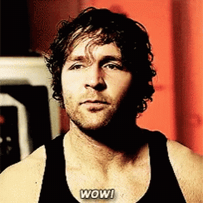 A Man In A Black Tank Top With The Word Wow Written On His Chest GIF