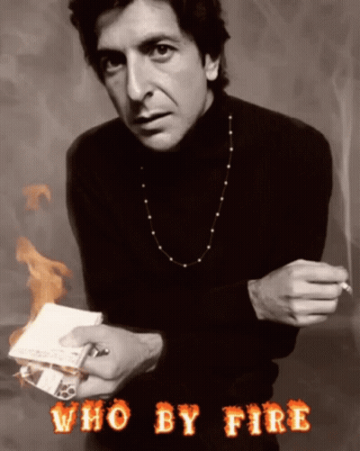 A Man In A Black Turtleneck Is Holding A Cigarette And A Piece Of Paper With The Words Who By Fire Above Him GIF