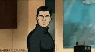 A Man In A Black Turtleneck Is Standing In Front Of A Wall With A Poster On It . GIF