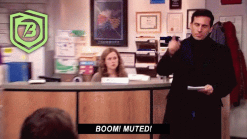 A Man In A Black Turtleneck Stands In Front Of A Woman At A Counter And Says Boom Muted GIF