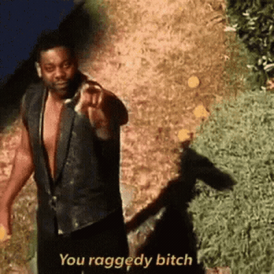 A Man In A Black Vest Is Pointing At The Camera And Saying `` You Raggedy Bitch '' . GIF