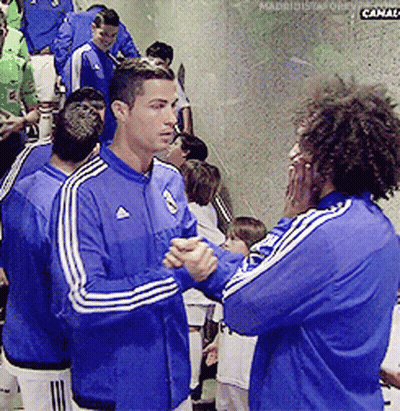 A Man In A Blue Adidas Jacket Talks To Another Man In A Blue Adidas Jacket GIF