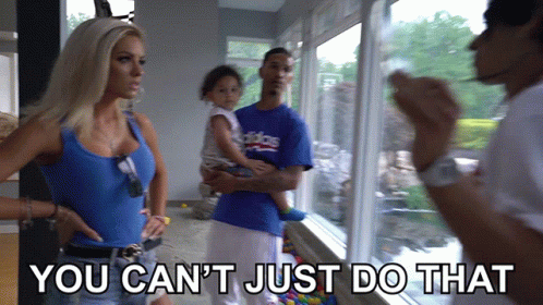A Man In A Blue Adidas Shirt Is Holding A Child GIF