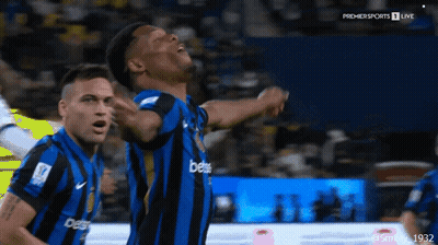A Man In A Blue And Black Striped Jersey With The Word Bets On It GIF
