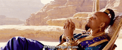 A Man In A Blue And Gold Outfit Is Laying In A Hammock And Says " I 'Ll Keep My Eye On You " GIF