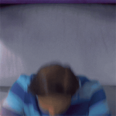 A Man In A Blue And Purple Striped Shirt Is Making A Funny Face And Says I Was Just Having GIF