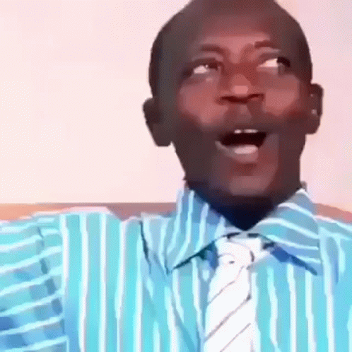 A Man In A Blue And White Striped Shirt And Tie Is Making A Funny Face . GIF