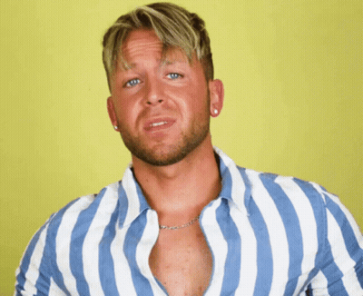 A Man In A Blue And White Striped Shirt Is Making A Face GIF