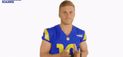 A Man In A Blue And Yellow Rams Jersey GIF