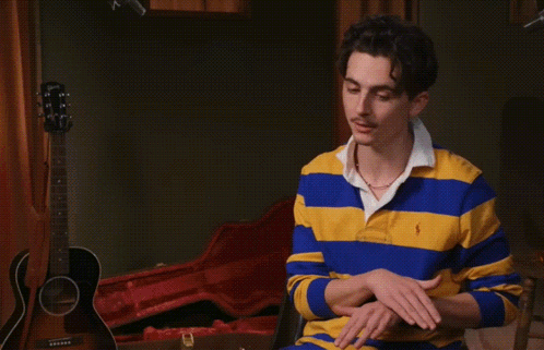 A Man In A Blue And Yellow Striped Shirt With The Words 100 % Mission Accomplished On The Bottom GIF