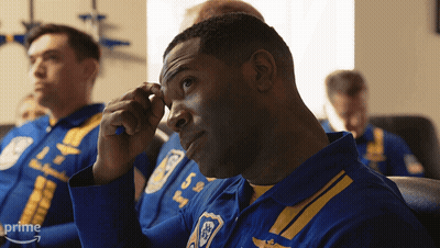 A Man In A Blue And Yellow Uniform Has The Number 5 On His Shirt GIF