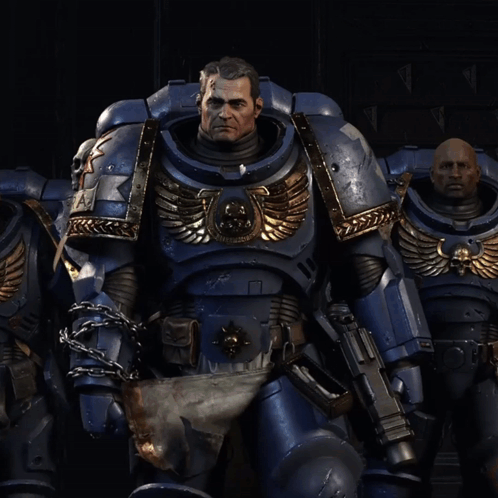 A Man In A Blue Armor With A Skull On The Chest GIF