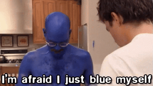A Man In A Blue Bodysuit Is Talking To Another Man In A Kitchen . GIF