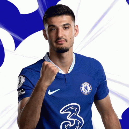 A Man In A Blue Chelsea Jersey Holds His Fist Up In The Air GIF
