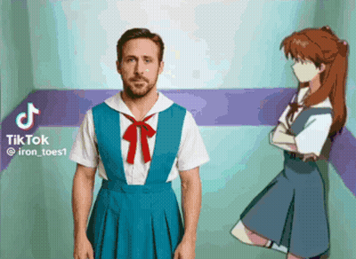 A Man In A Blue Dress Is Standing Next To A Girl In A Blue Dress GIF
