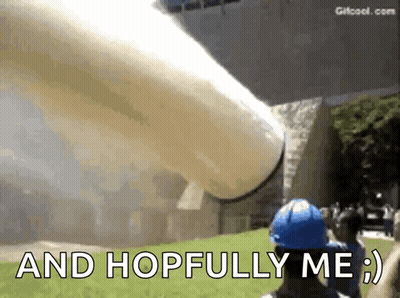 A Man In A Blue Hard Hat Says " And Hopfully Me " In Front Of A Large Inflatable Object GIF