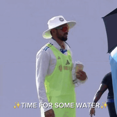 A Man In A Blue Hat Is Talking To Another Man In A White Shirt With The Words Time For Some Water On The Bottom GIF