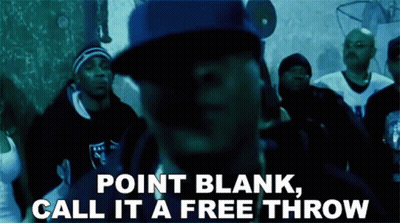 a man in a blue hat stands in front of a crowd with the words point blank call it a free throw above him