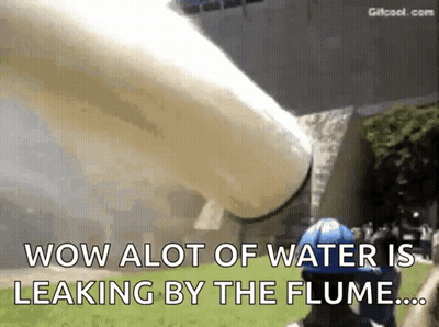 A Man In A Blue Helmet Is Standing In Front Of A Large Pipe That Says Wow Alot Of Water Is Leaking By The Flume GIF