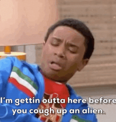 A Man In A Blue Jacket And Tie Is Talking About Getting Outta Here Before You Cough Up An Alien . GIF