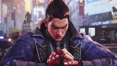 A Man In A Blue Jacket And Tie Is Wearing Red Gloves And A Blue Jacket . GIF