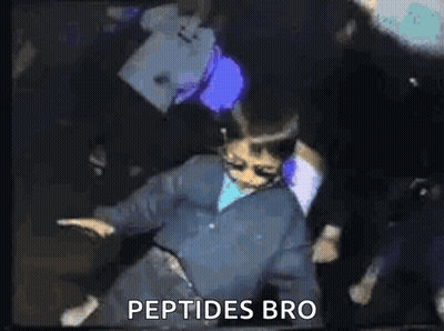 A Man In A Blue Jacket Is Dancing In A Dark Room With The Words `` Peptides Bro '' Written On The Bottom . GIF