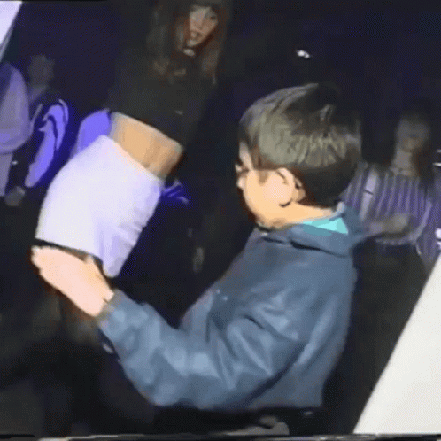 Man In Blue Jacket Holding Woman's Butt GIF