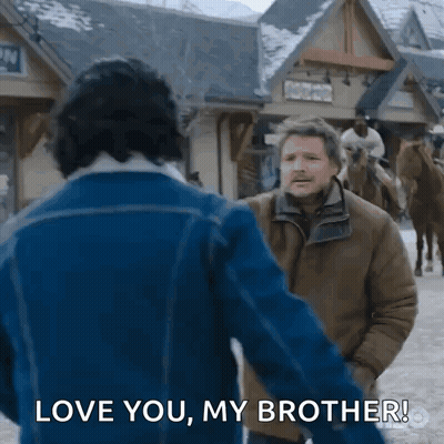 A Man In A Blue Jacket Is Holding The Hand Of Another Man In A Brown Jacket And Saying Love You My Brother . GIF