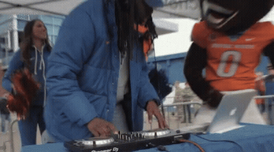 A Man In A Blue Jacket Is Playing A Pioneer Dj GIF