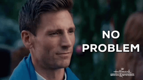 A Man In A Blue Jacket Is Smiling With The Words `` No Problem '' Written Above Him . GIF