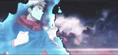 A Man In A Blue Jacket Is Standing In A Dark Room GIF