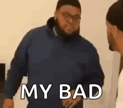 A Man In A Blue Jacket Is Standing Next To Another Man In A White Shirt And Talking To Him . GIF