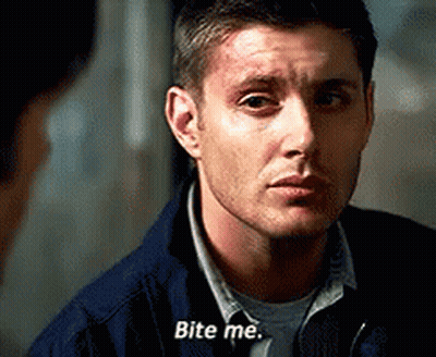 A Man In A Blue Jacket Is Talking To Another Man And Says `` Bite Me '' . GIF