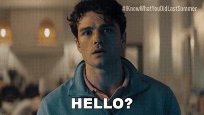 A Man In A Blue Jacket Says Hello In White Letters GIF
