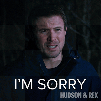 A Man In A Blue Jacket Says " I 'M Sorry " GIF
