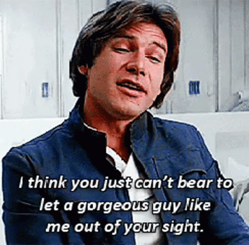 A Man In A Blue Jacket With A Quote On His Face GIF