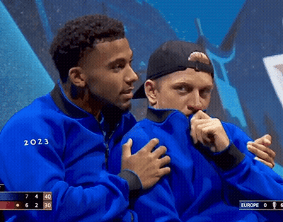 A Man In A Blue Jacket With The Year 2023 On It GIF