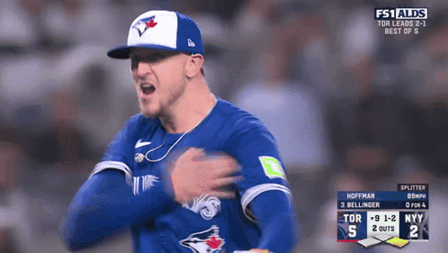 A Man In A Blue Jays Jersey Is On A Tv Screen GIF