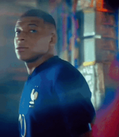 A Man In A Blue Jersey With The Number 10 On It GIF