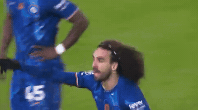 A Man In A Blue Jersey With The Number 45 On It Is Standing On A Soccer Field . GIF