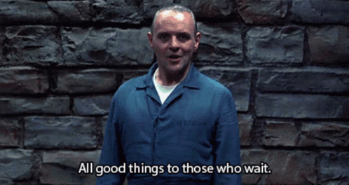 A Man In A Blue Jumpsuit Says All Good Things To Those Who Wait GIF