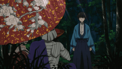 A Man In A Blue Kimono Stands In Front Of A Red Umbrella GIF