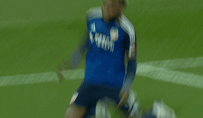A Man In A Blue Mercy Health Jersey Is Running On A Field GIF