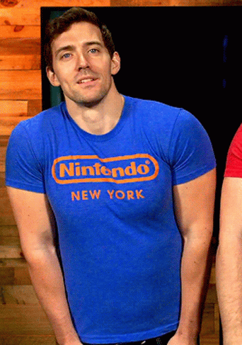 A Man In A Blue Nintendo New York Shirt GIF
